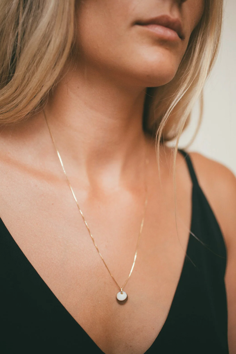The Golden Disc Puka Charm